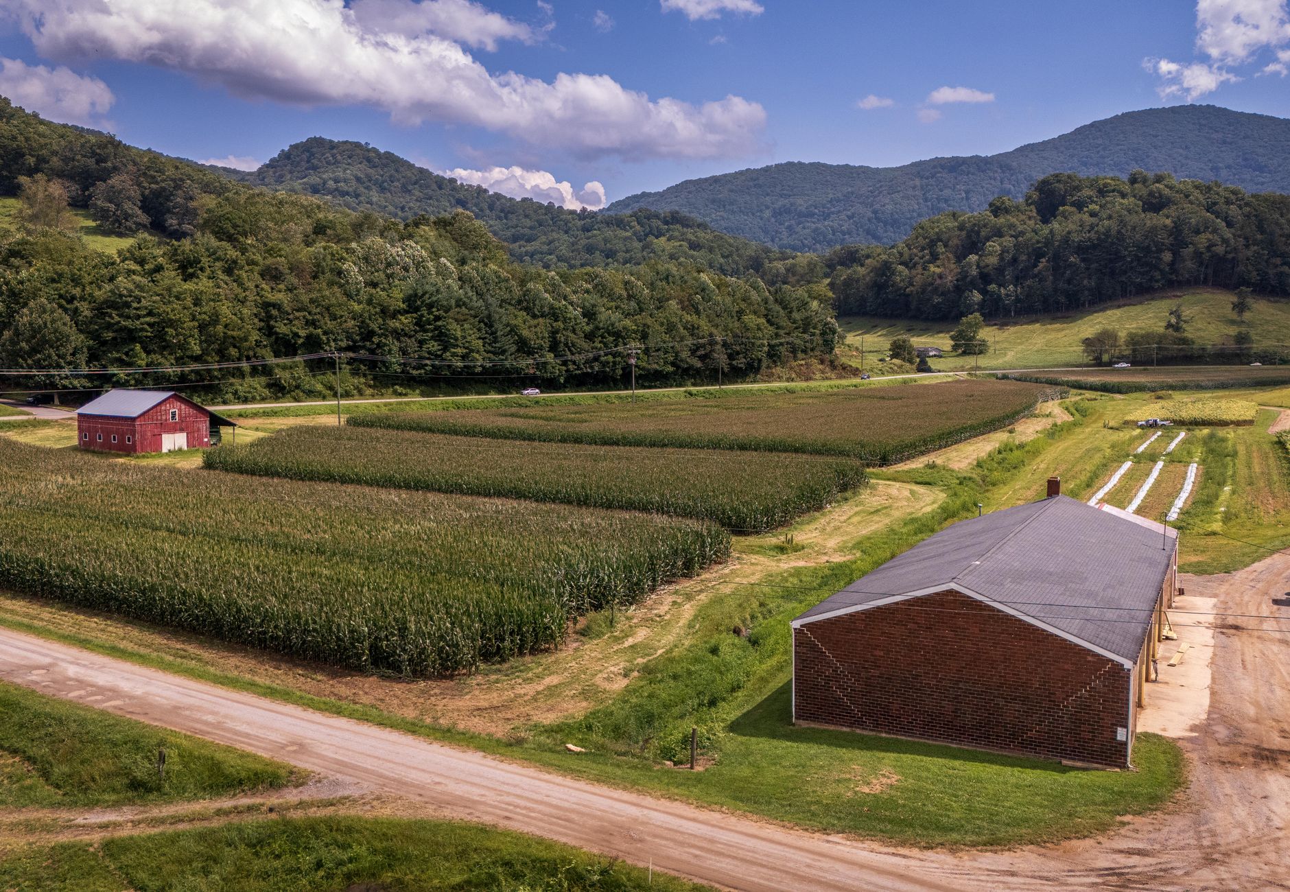 Aerial view of a picturesque farm landscape with fields and barns in North Carolina.