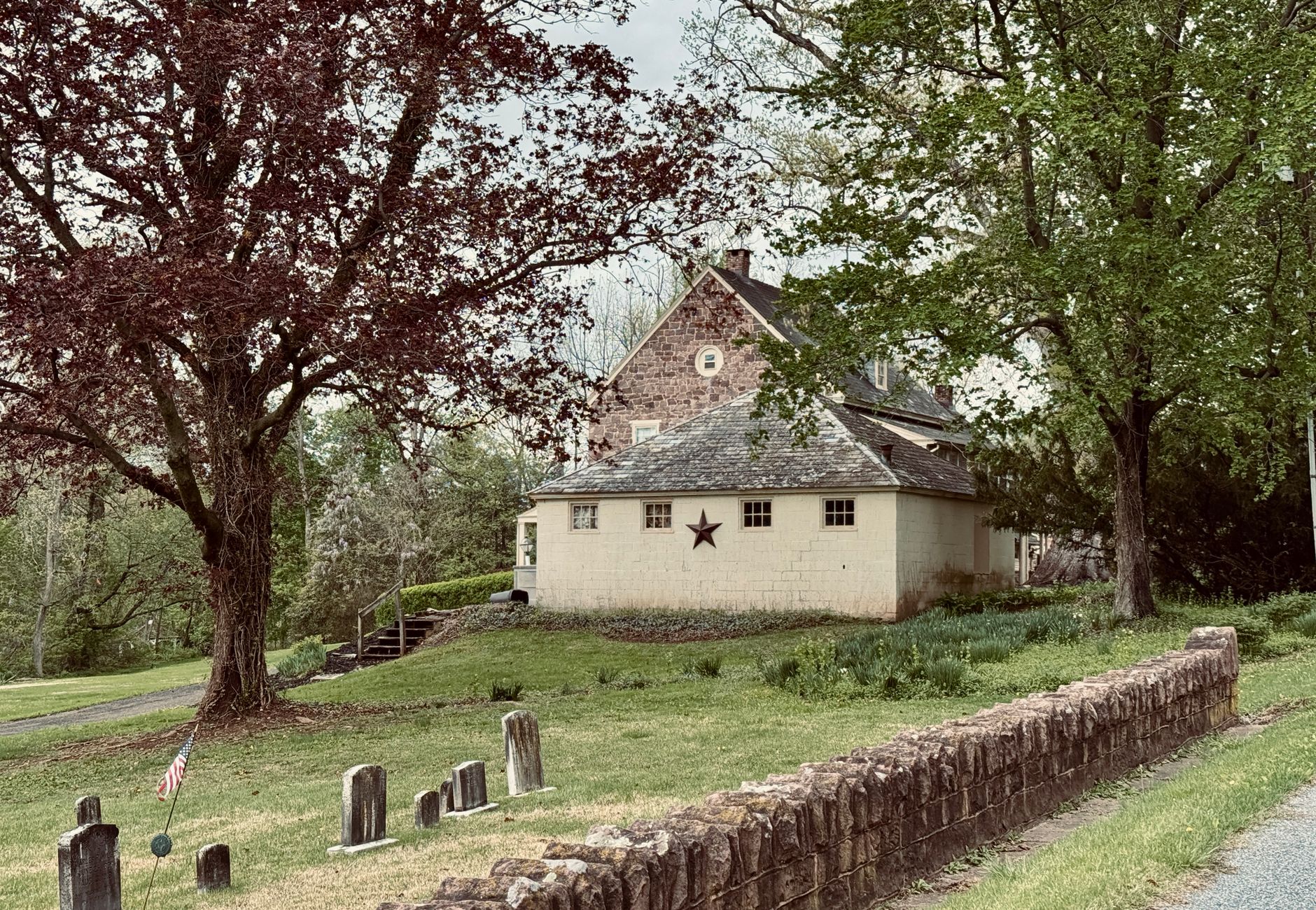 Old building and cemetery in a serene, historical landscape in Lancaster County.